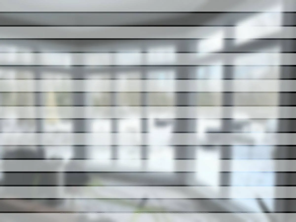 Frosted decorative privacy window film with a striped pattern applied to a residential window
