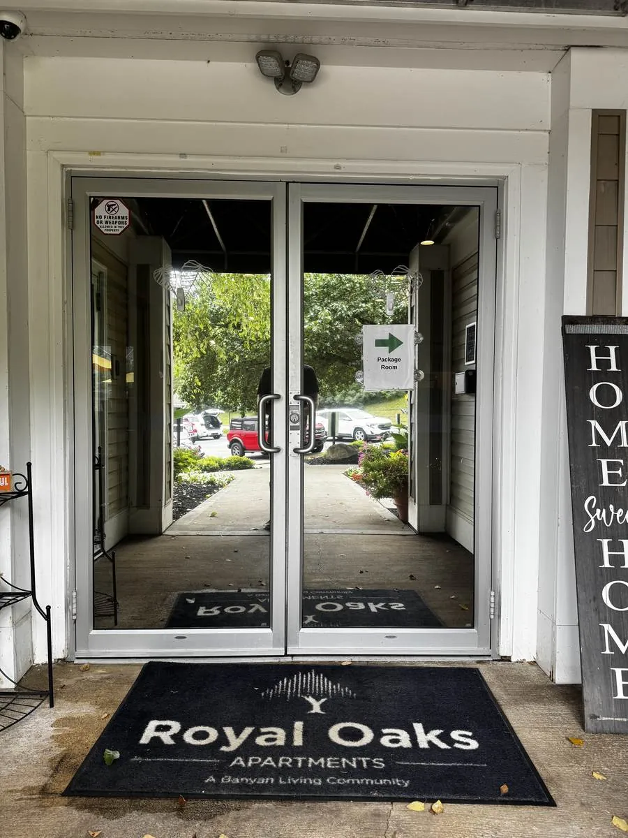 Glass entrance doors of a Cleveland apartment community with commercial window film installed by Raydiant